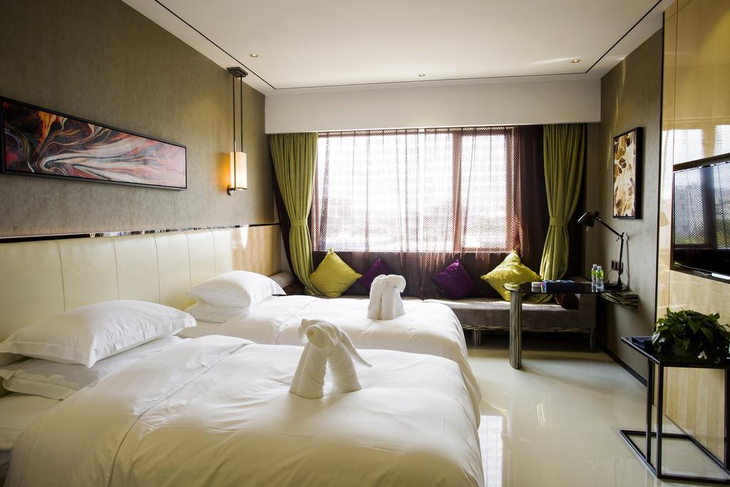 Lori Star Hotel Qionghai Quarto foto